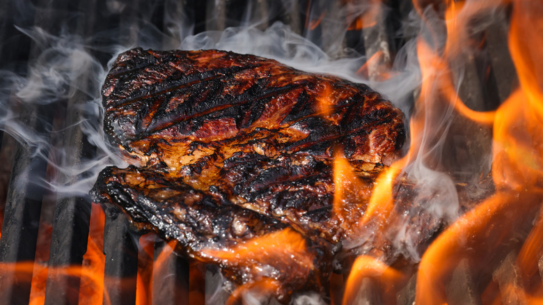 Grilled steak with flames