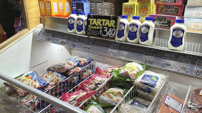 Tartar sauce display above frozen seafood