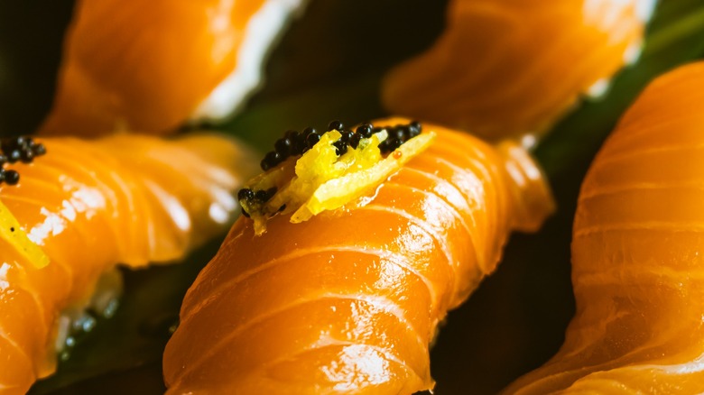 Salmon nigiri with yellow yuzu paste
