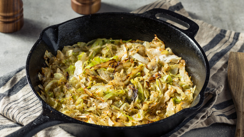 Sauteed cabbage served in a cast iron.