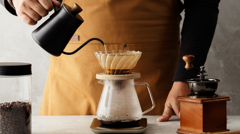 Coffee brewing with grinder and beans