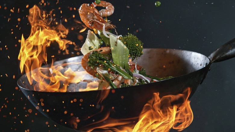 food being cooked in a wok