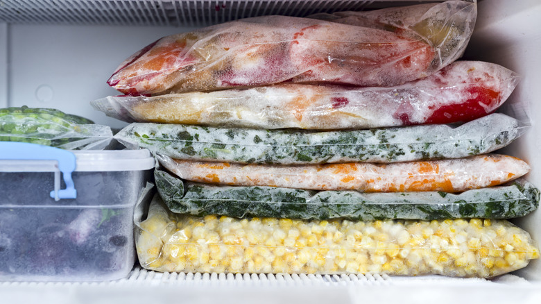 Foods frozen flat in zip-locked bags in freezer