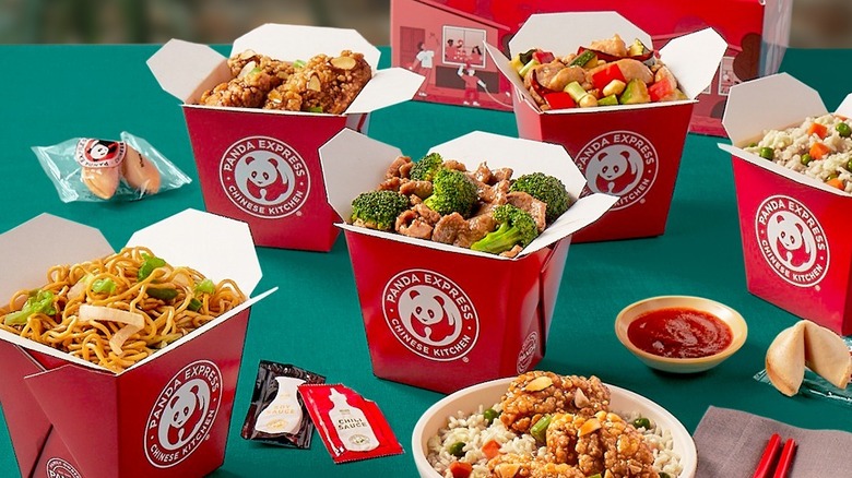 Containers with Panda Express food sit open on a table