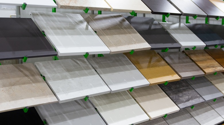 A wide variety of kitchen countertop samples sit on racks