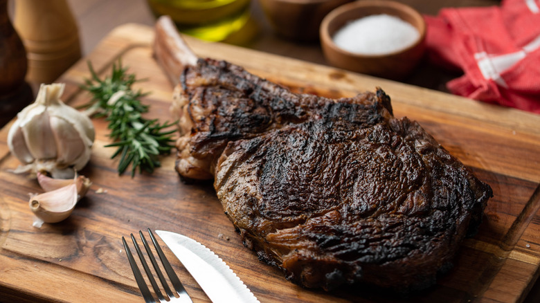 dry aged steak on cutting board