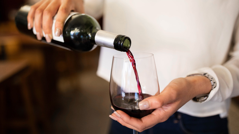 Pouring glass of red wine