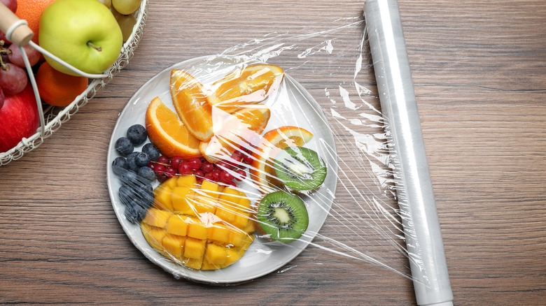 plastic wrap covering plate of fruit