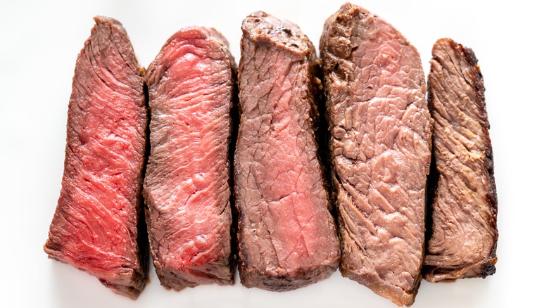 Steak at varying levels of doneness