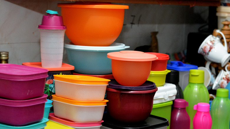 Plastic containers sit in a pile.
