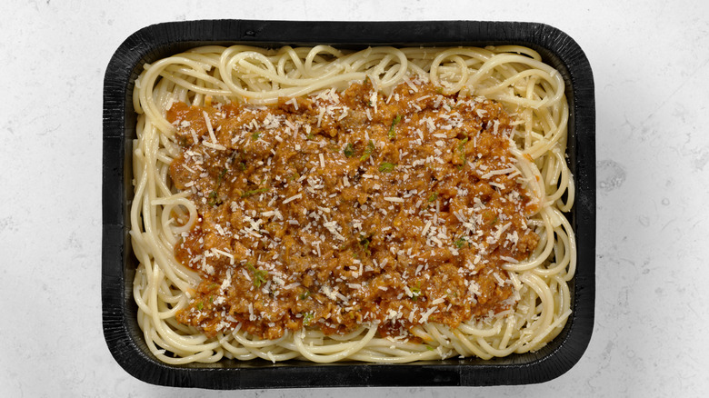spaghetti bolognese in takeout container