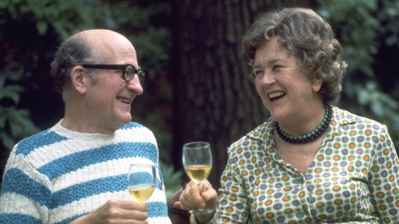 julia and paul child laughing and sharing wine