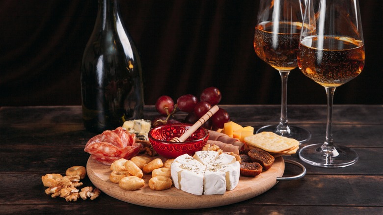 Cheese platter with two glasses of white port