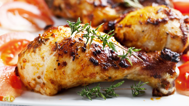 Seasoned chicken leg topped with herbs