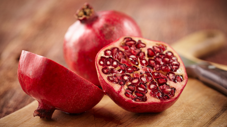 Pomegranates on a cutting board