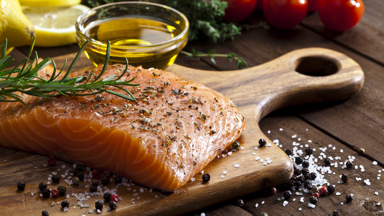 Raw fish on a wooden cutting board
