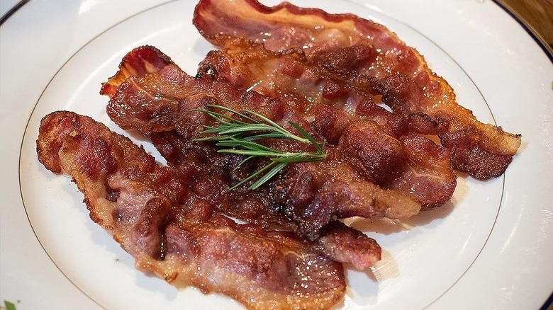 black angus beef bacon on plate with rosemary