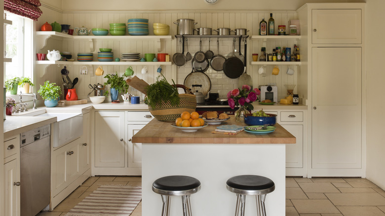 A well-stocked white kitchen with island