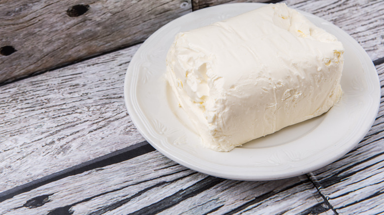 Block of cream cheese on a plate