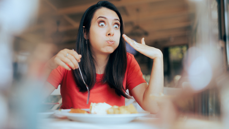 person eating very spicy food