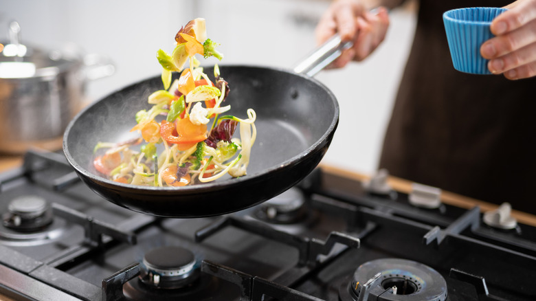 Person cooking in a non-stick pan