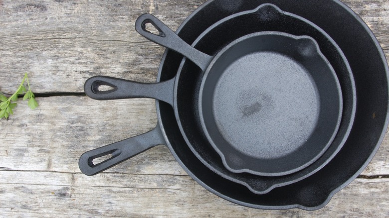 stack of cast iron skillets