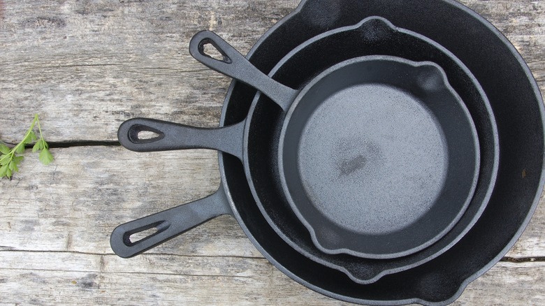 Three nestled cast iron skillets