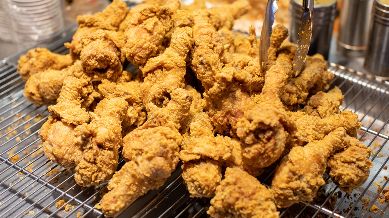 A pile of chicken resting on a wire rack