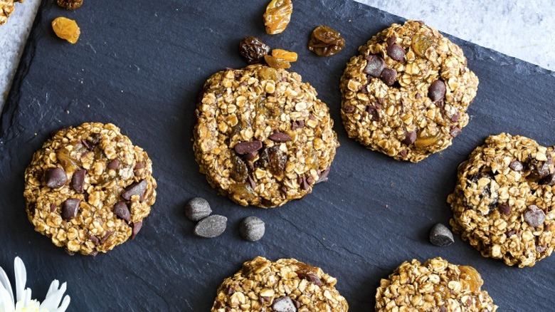 No-bake chocolate and oat cookies on a black serving board