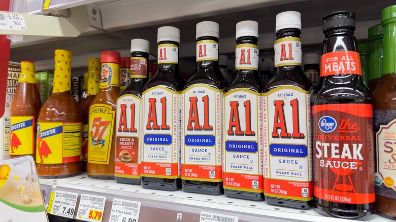 various steak sauces on a shelf in the supermarket