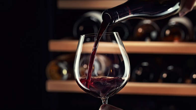 wine being poured in a glass