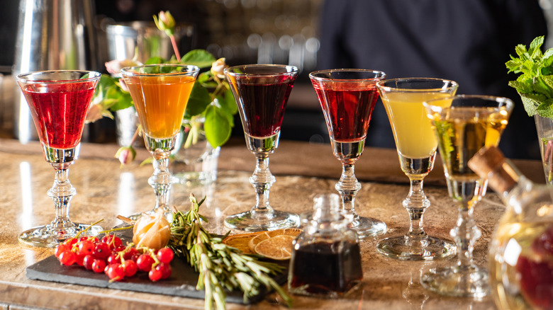 Different flavors of shrubs in small glasses