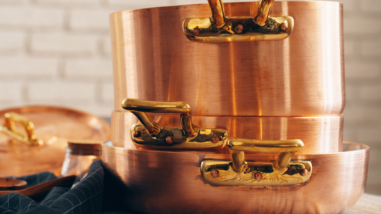 Shiny copper pots for kitchen