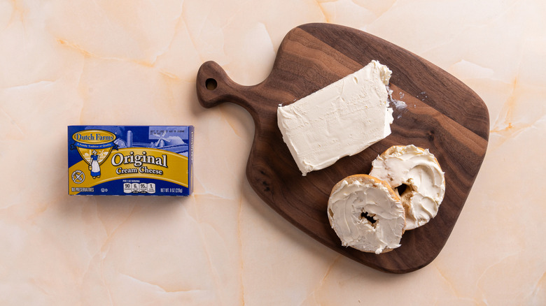 Dutch Farms cream cheese on a wooden serving platter.
