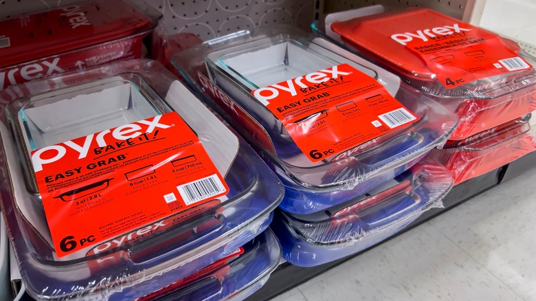 stack of glass Pyrex baking dishes on a shop shelf