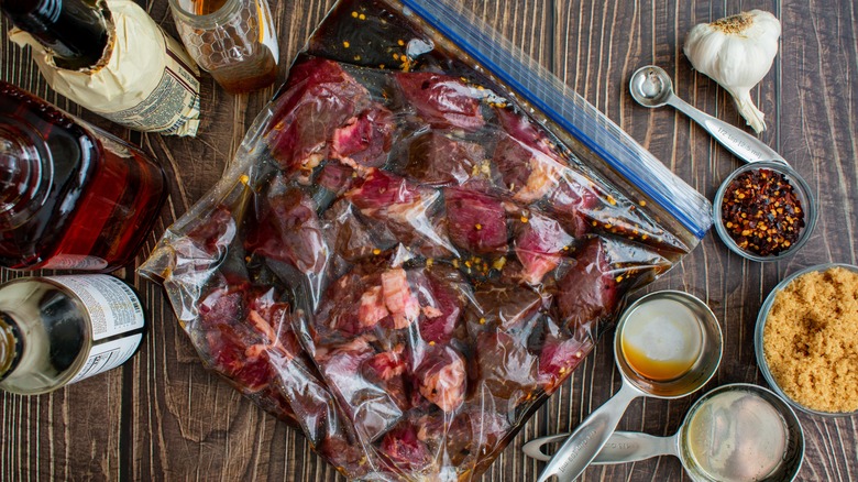 Steak tips marinating in a plastic zip-top bag