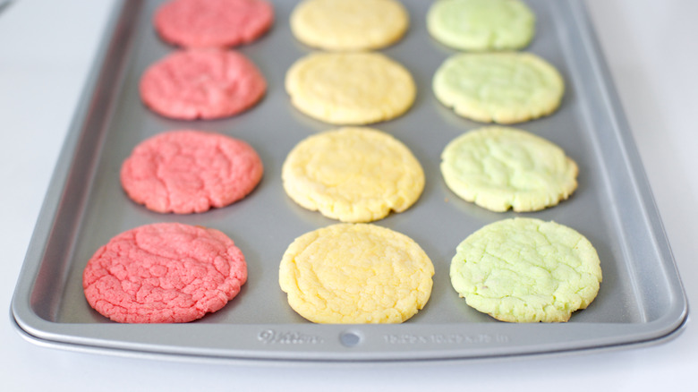 a tray has red, yellow, and pastel green Jell-O cookies on it