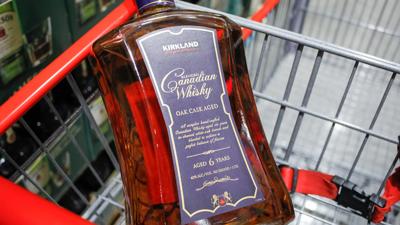 Costco's Kirkland Signature Canadian Whisky pictured in a shopping cart.