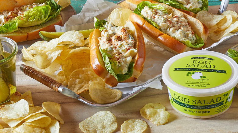 Trader Joe's Egg Salad alongside egg salad sandwiches and chips