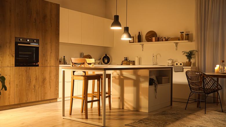 A kitchen lit with cozy lighting
