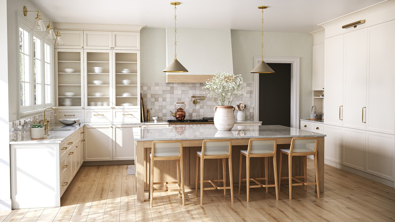 A clean and bright primarily white kitchen