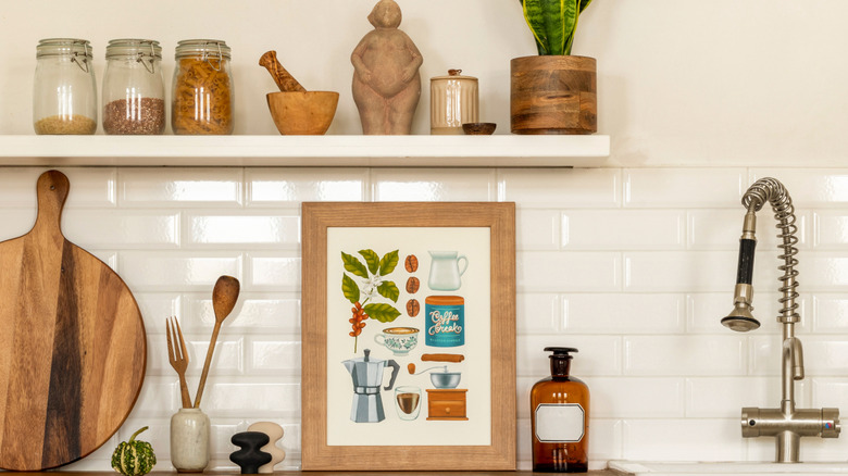 Kitchen shelves styled with art and sculptural ceramics