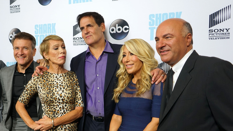 The cast of Shark Tank pose for a picture on the red carpet