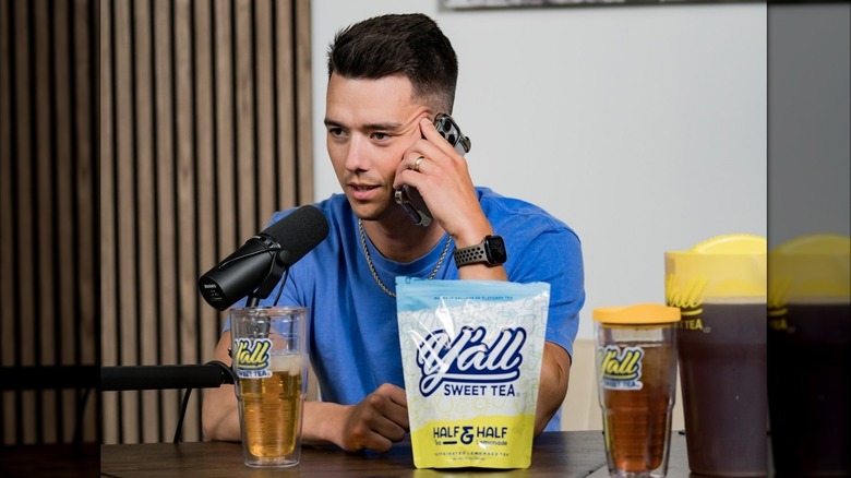 One of the founders sitting at a desk during an interview with Y'all Sweet tea