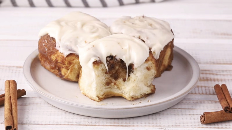 Plate of King's Hawaiian cinnamon rolls with frosting