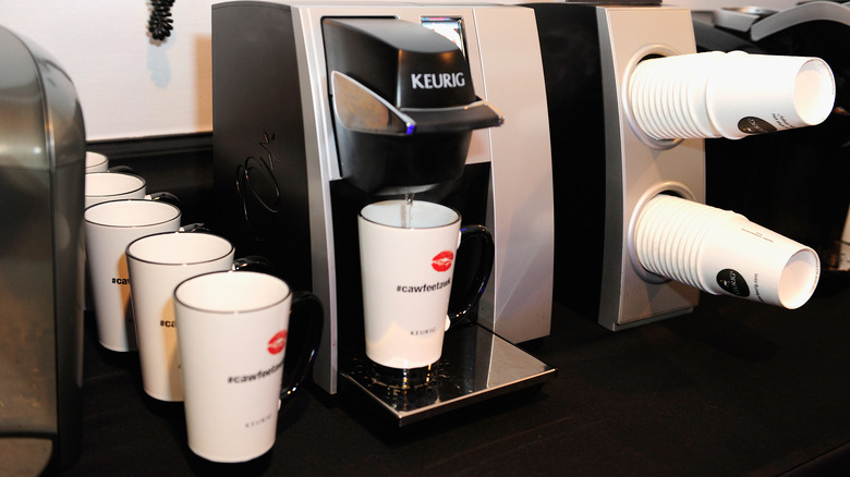 A Keurig machine pouring water