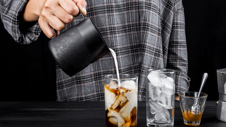 cream being poured into cold drink