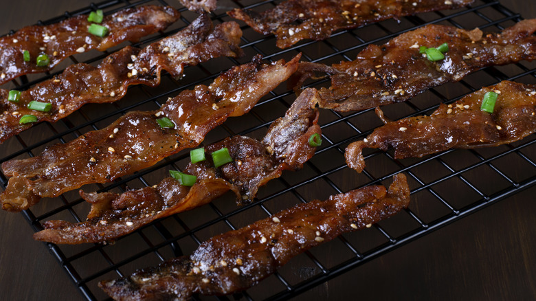 maple glazed bacon cooling on a wire rack