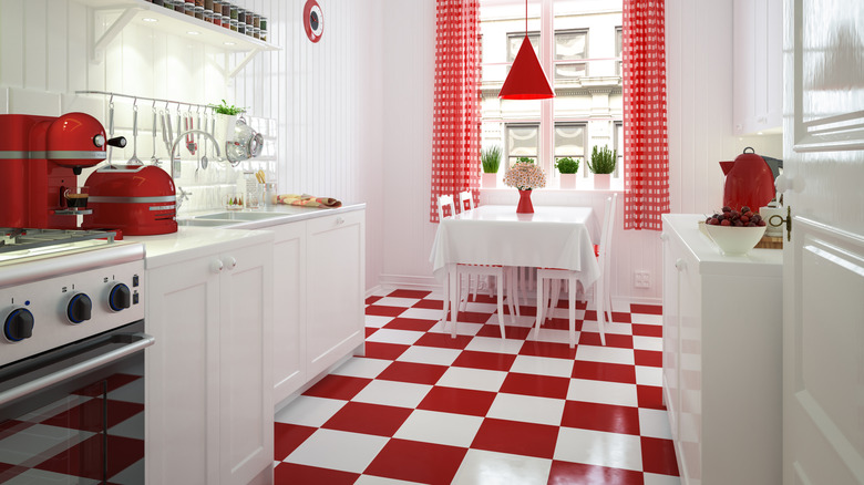 A kitchen with a red checkered floor