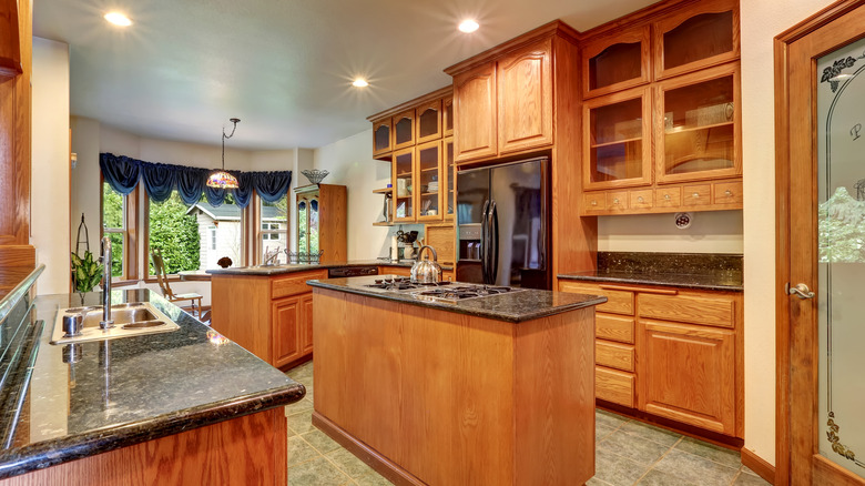Kitchen with glass-front wood cabinets